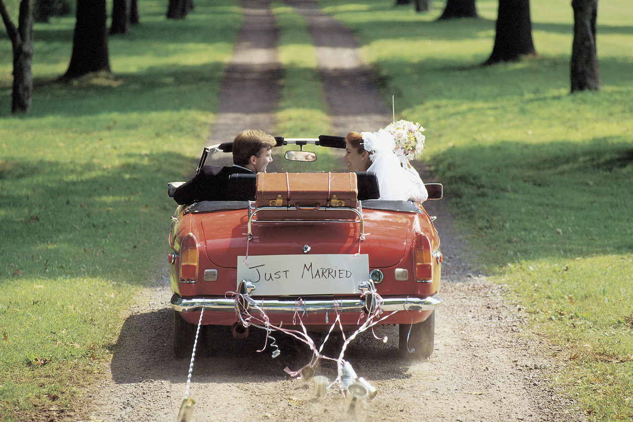 Bride and Groom, Just Married, Driving Away in Car