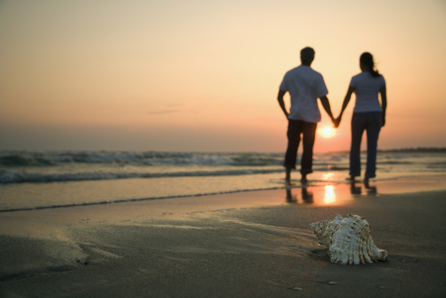 Couple holding hands.